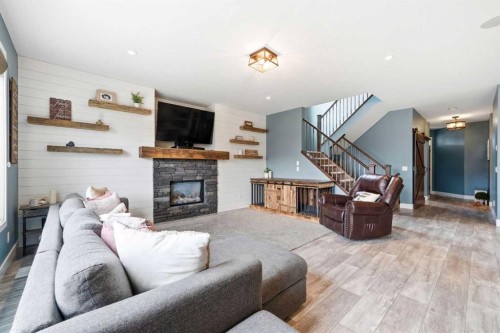 6 Ranchers Manor, Okotoks, AB - Indoor Photo Showing Living Room With Fireplace