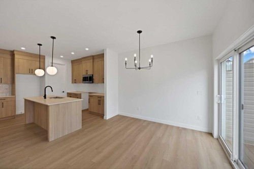 82 Heritage Circle, Cochrane, AB - Indoor Photo Showing Kitchen With Upgraded Kitchen