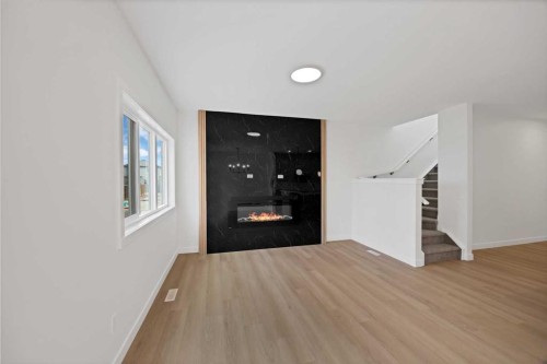 82 Heritage Circle, Cochrane, AB - Indoor With Fireplace