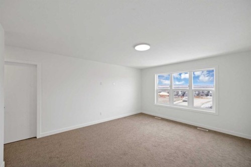 82 Heritage Circle, Cochrane, AB - Indoor Photo Showing Other Room