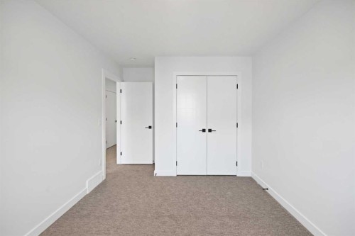 82 Heritage Circle, Cochrane, AB - Indoor Photo Showing Other Room