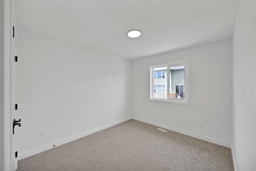 82 Heritage Circle, Cochrane, AB - Indoor Photo Showing Other Room