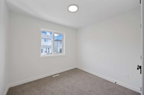 82 Heritage Circle, Cochrane, AB - Indoor Photo Showing Other Room