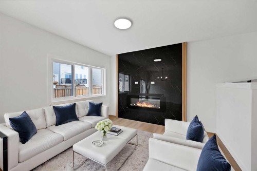 82 Heritage Circle, Cochrane, AB - Indoor Photo Showing Living Room With Fireplace