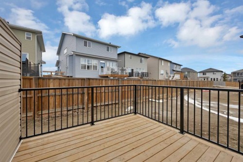 82 Heritage Circle, Cochrane, AB - Outdoor With Deck Patio Veranda With Exterior