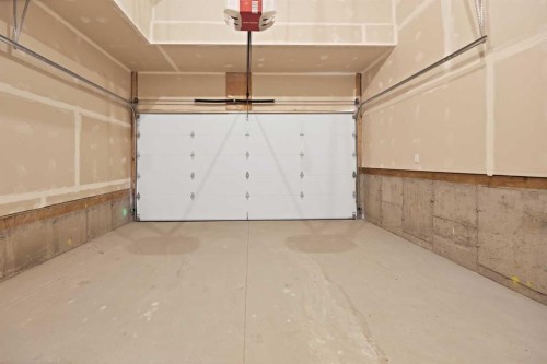82 Heritage Circle, Cochrane, AB - Indoor Photo Showing Garage