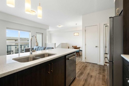 132 Spring Creek Common Sw, Calgary, AB - Indoor Photo Showing Kitchen With Double Sink With Upgraded Kitchen