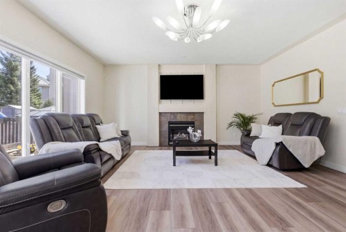 18 Royal Crest Way Nw, Calgary, AB - Indoor Photo Showing Living Room With Fireplace