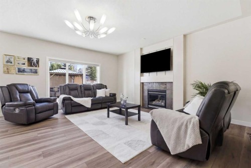18 Royal Crest Way Nw, Calgary, AB - Indoor Photo Showing Living Room With Fireplace