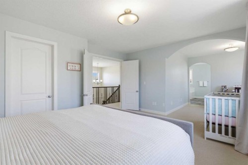 18 Royal Crest Way Nw, Calgary, AB - Indoor Photo Showing Bedroom