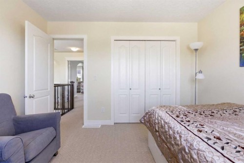 18 Royal Crest Way Nw, Calgary, AB - Indoor Photo Showing Bedroom