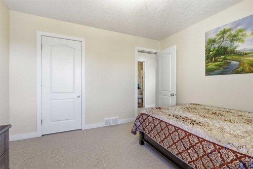 18 Royal Crest Way Nw, Calgary, AB - Indoor Photo Showing Bedroom