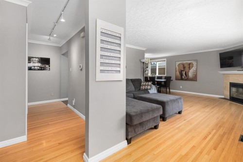 3144 Breen Crescent Nw, Calgary, AB - Indoor Photo Showing Living Room With Fireplace