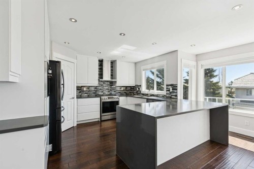 15 Springbank View Sw, Calgary, AB - Indoor Photo Showing Kitchen With Upgraded Kitchen