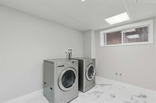 15 Springbank View Sw, Calgary, AB - Indoor Photo Showing Laundry Room
