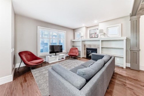 55 Aspen Meadows Green Sw, Calgary, AB - Indoor Photo Showing Living Room With Fireplace