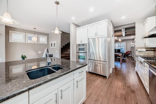 55 Aspen Meadows Green Sw, Calgary, AB - Indoor Photo Showing Kitchen With Stainless Steel Kitchen With Double Sink With Upgraded Kitchen