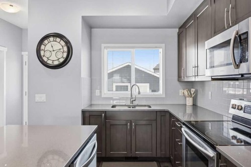 571 Mahogany Boulevard Se, Calgary, AB - Indoor Photo Showing Kitchen With Stainless Steel Kitchen With Double Sink With Upgraded Kitchen