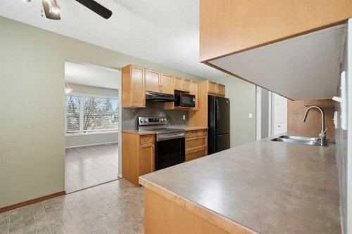138 Midcrest Crescent Se, Calgary, AB - Indoor Photo Showing Kitchen With Double Sink