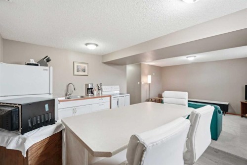 138 Midcrest Crescent Se, Calgary, AB - Indoor Photo Showing Kitchen With Double Sink
