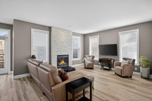 385 Rainbow Falls Way, Chestermere, AB - Indoor Photo Showing Living Room With Fireplace