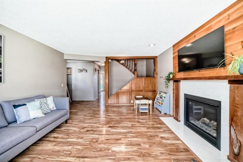 87 Berwick Crescent Nw, Calgary, AB - Indoor Photo Showing Living Room With Fireplace