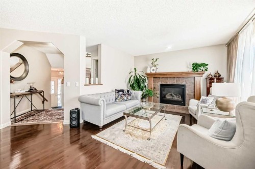 198 Everstone Drive Sw, Calgary, AB - Indoor Photo Showing Living Room With Fireplace