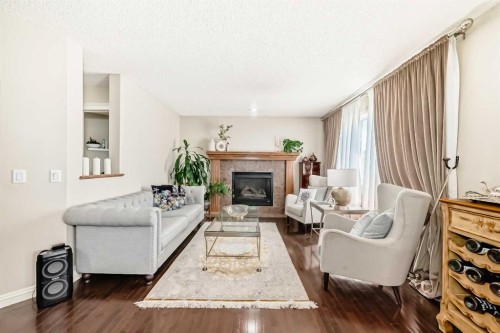198 Everstone Drive Sw, Calgary, AB - Indoor Photo Showing Living Room With Fireplace