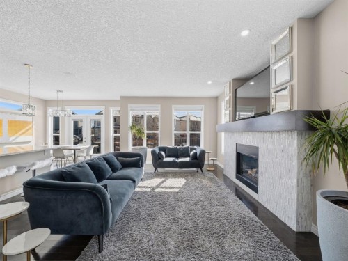 91 Silverado Ridge Crescent Sw, Calgary, AB - Indoor Photo Showing Living Room With Fireplace