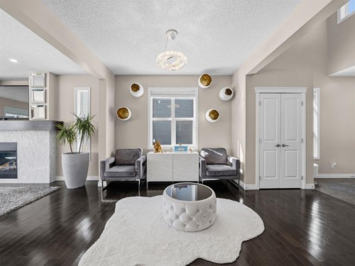 91 Silverado Ridge Crescent Sw, Calgary, AB - Indoor Photo Showing Living Room With Fireplace