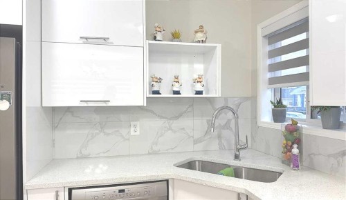 86 Harvest Rose Circle Ne, Calgary, AB - Indoor Photo Showing Kitchen With Double Sink