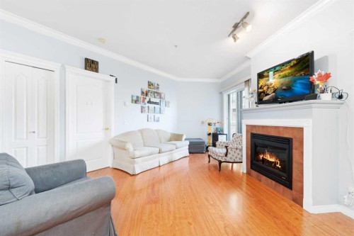 343-333 Riverfront Avenue Se, Calgary, AB - Indoor Photo Showing Living Room With Fireplace