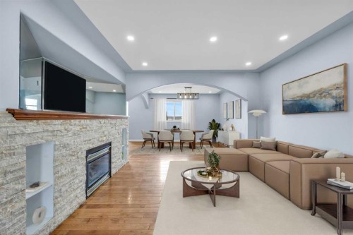 166 Tuscarora Close Nw, Calgary, AB - Indoor Photo Showing Living Room With Fireplace
