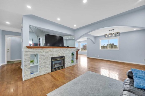 166 Tuscarora Close Nw, Calgary, AB - Indoor Photo Showing Living Room With Fireplace