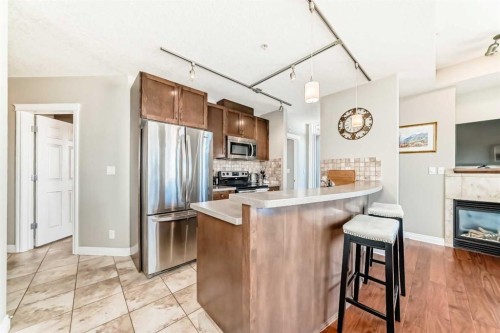 3506-24 Hemlock Crescent Sw, Calgary, AB - Indoor Photo Showing Kitchen With Fireplace