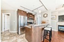 3506-24 Hemlock Crescent Sw, Calgary, AB  - Indoor Photo Showing Kitchen With Fireplace 