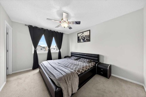 244 Silverado Range View Sw, Calgary, AB - Indoor Photo Showing Bedroom