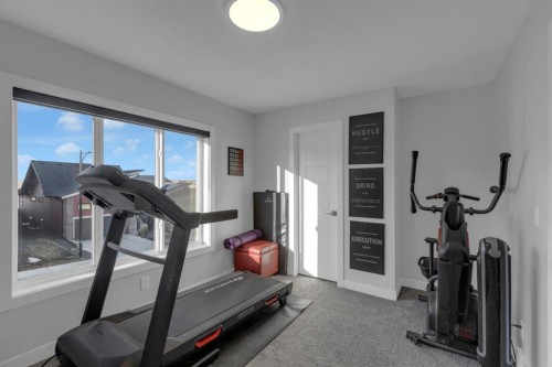 160 Precedence Hill, Cochrane, AB - Indoor Photo Showing Gym Room