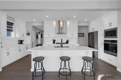160 Precedence Hill, Cochrane, AB - Indoor Photo Showing Kitchen With Upgraded Kitchen