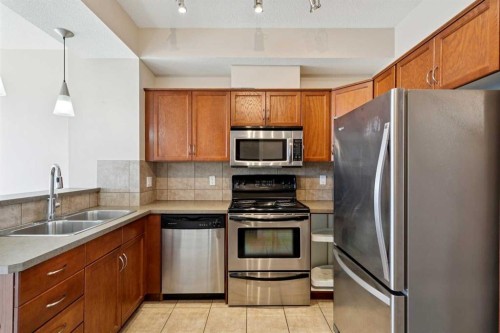 14-169 Rockyledge View Nw, Calgary, AB - Indoor Photo Showing Kitchen With Double Sink