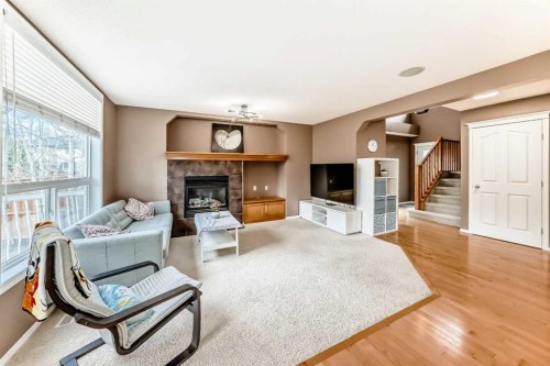 250 Royal Birch Way Nw, Calgary, AB - Indoor Photo Showing Living Room With Fireplace