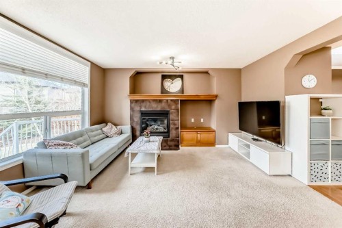 250 Royal Birch Way Nw, Calgary, AB - Indoor Photo Showing Living Room With Fireplace
