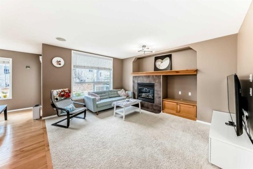 250 Royal Birch Way Nw, Calgary, AB - Indoor Photo Showing Living Room With Fireplace