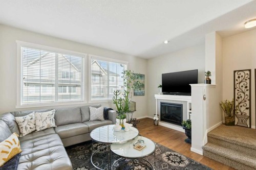46 Kinlea Common Nw, Calgary, AB - Indoor Photo Showing Living Room With Fireplace