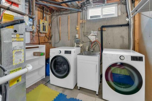79 Scenic Way Nw, Calgary, AB - Indoor Photo Showing Laundry Room