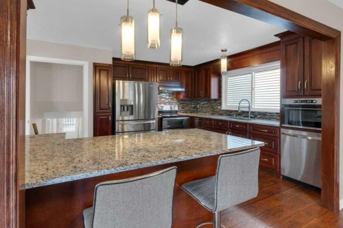 79 Scenic Way Nw, Calgary, AB - Indoor Photo Showing Kitchen With Double Sink