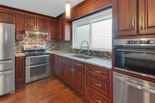 79 Scenic Way Nw, Calgary, AB - Indoor Photo Showing Kitchen With Double Sink