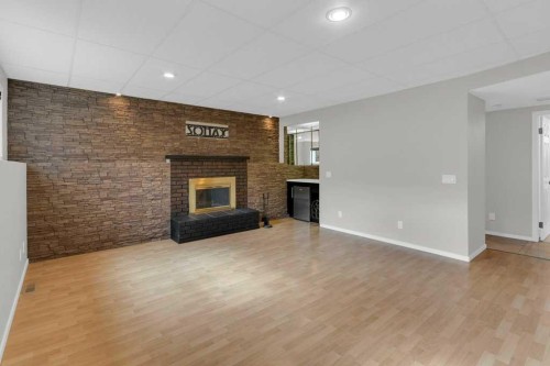 79 Scenic Way Nw, Calgary, AB - Indoor With Fireplace