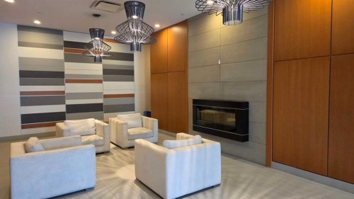 407-560 6 Avenue Se, Calgary, AB - Indoor Photo Showing Living Room With Fireplace