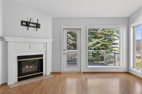 35 Douglasview Park Se, Calgary, AB - Indoor Photo Showing Living Room With Fireplace